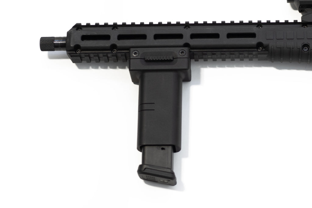 A close-up of a black tactical firearm accessory, specifically a vertical foregrip for KelTec Sub2000 Gen 3 in 9mm. attached to a picatinny rail handguard, on a plain white background.