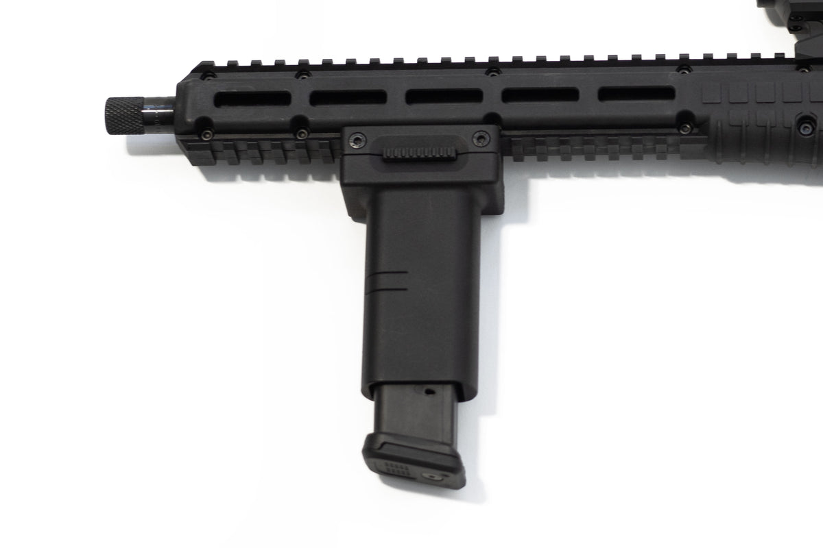 A close-up of a black tactical firearm accessory, specifically a vertical foregrip for KelTec Sub2000 Gen 3 in 9mm. attached to a picatinny rail handguard, on a plain white background.